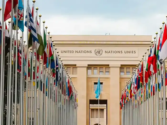 The Palais des Nations in Geneva, framed by two rows of national flags